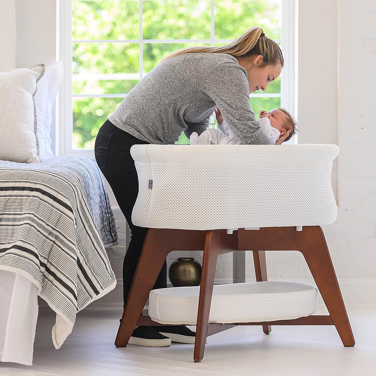 Evi Smart Baby Bassinet Beside Sleeper with Auto-Glide, Ambient Nightlight & Sensory Sounds, Compatible with Alexa and Google Home, Includes 2 Sheets (Soft White W/Natural Legs)